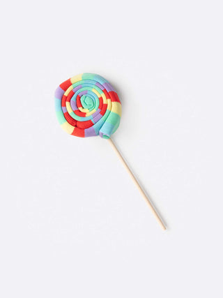 Socks rolled up on a stick covered with plastic to resemble a lollipop