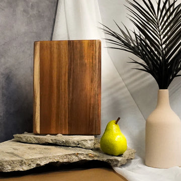 Date Night-Sized Raw Cutting Board - Rectangular raw acacia wood cutting board with natural grain and smooth edges, medium size.
