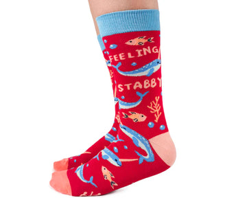 Women's Naughty Narwhal Socks - Red and blue women's socks with narwhal designs and "Feeling Stabby" text, unique handmade Canadian gift.