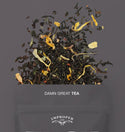 The top quarter of the bag is visible with a blend of tea leaves spilling out of the bag