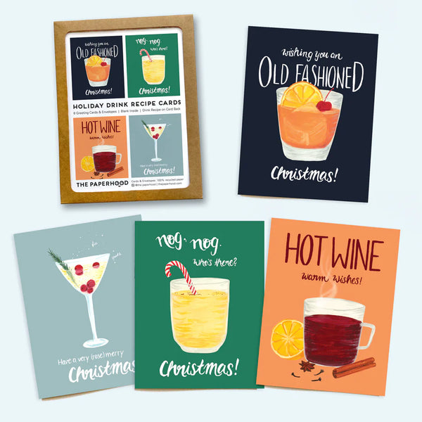 All 4 card designs next to the brown packaging