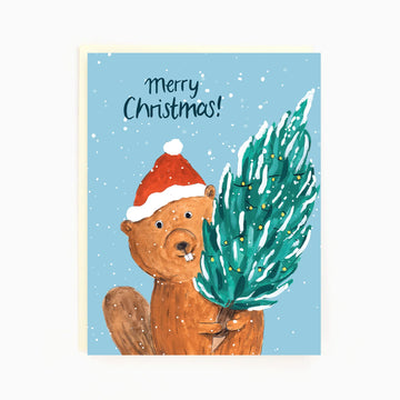 Holiday Beaver Card | The Paperhood - Handmade Canadian holiday card featuring a beaver in a Santa hat holding a Christmas tree gift.