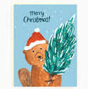 A sky blue card with a beaver wearing a Santa hat and holding a decorated Christmas tree