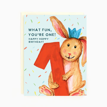 1st Birthday Bunny Card | The Paperhood - Handmade Canadian birthday card with a smiling bunny holding a red number one, colorful confetti background, unique gift.