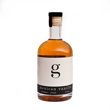 Mexican Vanilla Gourmet Coffee Syrup - Glass bottle of Mexican Vanilla gourmet coffee syrup with black and white label, unique handmade Canadian gift.