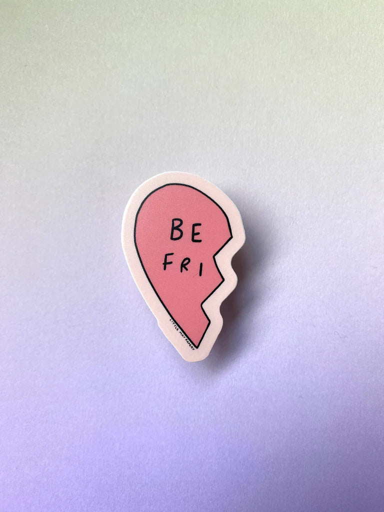 One half of the sticker, a half heart with the words "Be Fri"