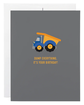 A dark blue card with a picture of a dump truck and the words "Dump Everything It's Your Birthday!"