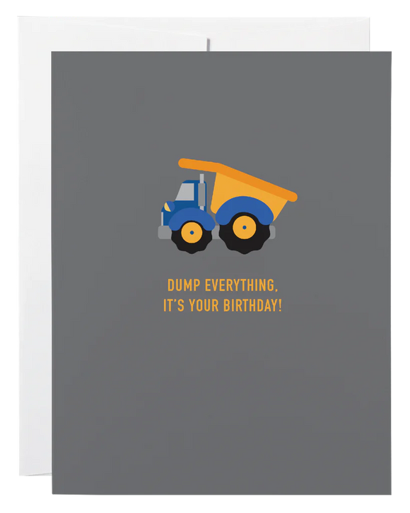 A dark blue card with a picture of a dump truck and the words "Dump Everything It's Your Birthday!"