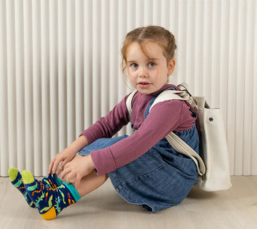 Kids Buggin' Out Socks - Colorful handmade kids socks with playful bug patterns, unique Canadian gift, worn by child.