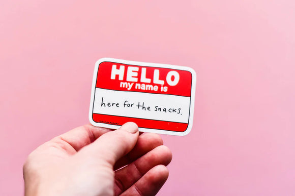 A vinyl sticker of a name tag that says "Hello My Name is here for the snacks"
