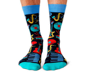 Men's Music Mania Socks - Men's black socks with bright turquoise toes and cuffs, featuring colorful handmade musical instruments, a unique Canadian.