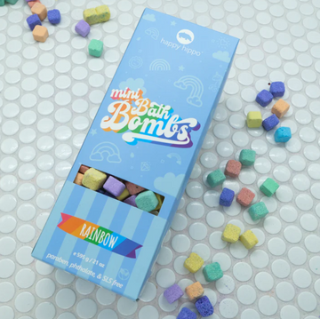 Mini Bath Bomb Box - Bright blue Mini Bath Bomb Box with colorful handmade bath bombs scattered around, unique Canadian spa gift.