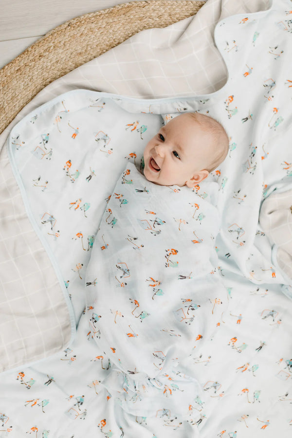 A baby in the ice hockey muslin swaddle