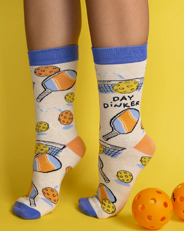 Women's Pickleball Socks - Handmade Canadian pickleball socks for women with "Day Drinker" text, blue cuffs, and orange paddle design, unique gift idea.