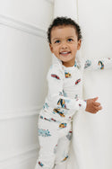 A baby wearing All Aboard 2-pc Pajama Set (LouLou Lollipop)