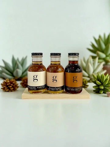 Syrup Gift Box | Gourmet Inspirations - Handmade Canadian syrup gift set with three unique glass bottles on wood tray.