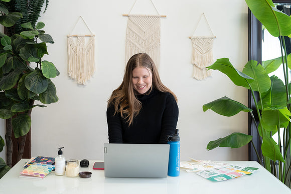 Megan Munro of Caribou Gifts working on laptop
