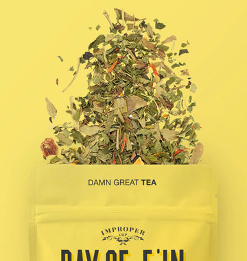 Ray of F'in Sunshine Tea - Ray of F'in Sunshine herbal tea with loose leaves spilling from a handmade Canadian gift pouch.