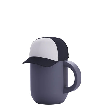 Happy Hats Trucker Cap Black - Black and white trucker cap with mesh back and curved brim atop matte gray ceramic mug with handle.