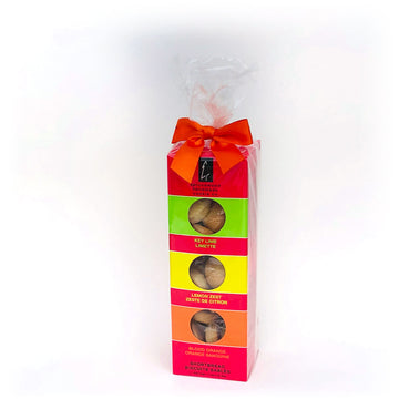 Citrus Collection Shortbread Gift Set | Sprucewood Handmade Cookie Co - Tall rectangular gift box with four compartments of colorful handmade Canadian shortbread cookies, tied with a red bow.