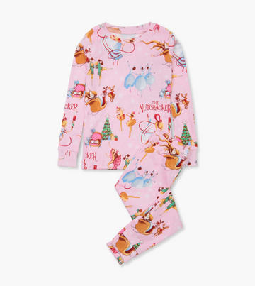 The Nutcracker Pajama Set - Pink long-sleeve pajamas with Nutcracker-themed illustrations featuring mice, soldiers, and festive trees.