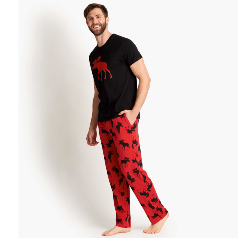 A man wearing the Moose On Red Men's Jersey Pajama Pants