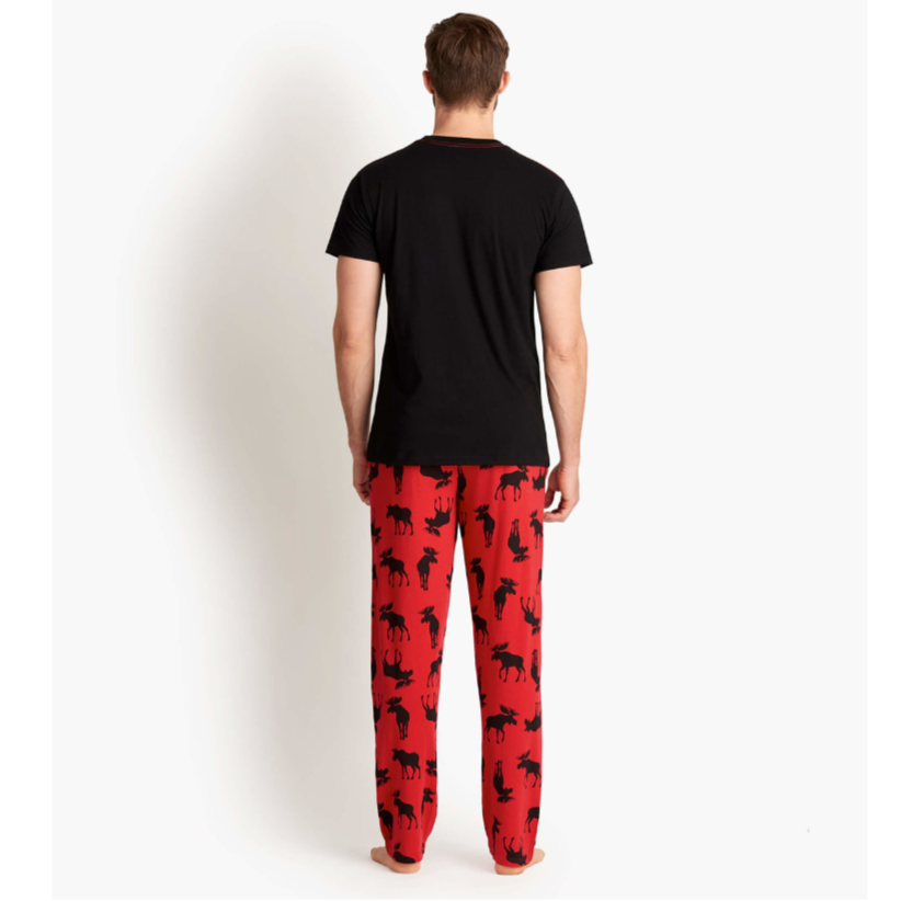 A man wearing the Moose On Red Men's Jersey Pajama Pants