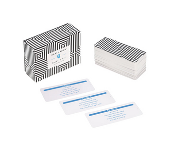 What Am I? Card Game - What Am I? card game with black and white striped box and minimalist blue text cards, unique Canadian handmade gift.