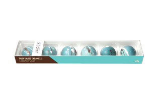 A skinny box with 6 blue chocolate balls lined up