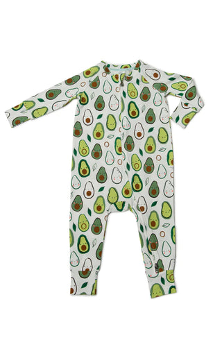 An off-white sleeper lain out with different avocados printed all over it
