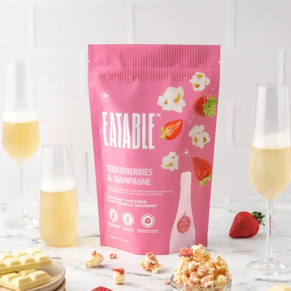 Strawberries & Champagne - Gourmet Popcorn - Pink package of Strawberries & Champagne gourmet popcorn with popped popcorn and champagne glasses, handmade Canadian gift.