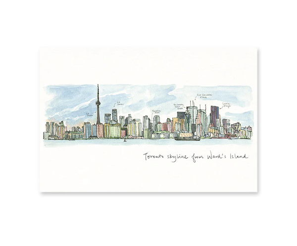 A white card with an illustrated view of the Toronto skyline with labels on notable buildings such as the CN tower. Underneath in script reads 