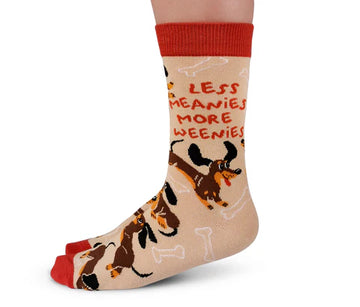 Women's Meanie Weenie Socks - Beige socks with red cuffs and toes featuring a playful dachshund design and "Less Meanies More Weenies" text, unique.