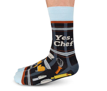 Men's Yes Chef Socks - Men’s Yes Chef socks in black with white lettering and colorful kitchen utensil patterns, handmade Canadian gift.