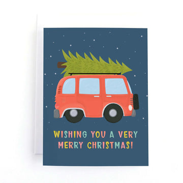 Cute Christmas Van Holiday Card - Handmade Canadian Christmas card with a red van carrying a green tree and festive greeting.