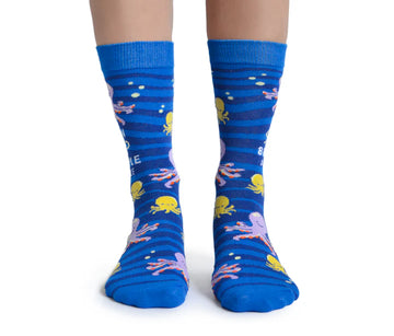 Women's Obscene Octopus Socks - Blue crew socks with yellow and pink octopus and fish patterns, unique handmade Canadian gift.