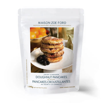 Crispy Cinnamon Doughnut Pancake Mix | Maison Zoe Ford - Maison Zoe Ford Crispy Cinnamon Doughnut Pancake Mix package with stack of golden brown pancakes and blackberries, unique.