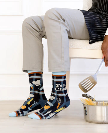 Men's Yes Chef Socks - Black socks with white "Yes Chef" text, kitchen utensils pattern, handmade Canadian gift design.