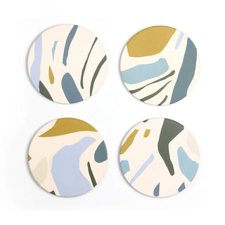 A set of 4 coasters with splotches of light blue, dark blue, cream and mustard 