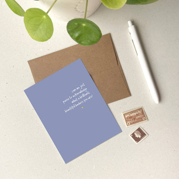 Beautiful Badass Card - Purple greeting card with gold foil text and minimalist design, paired with a brown envelope and white pen on white surface.