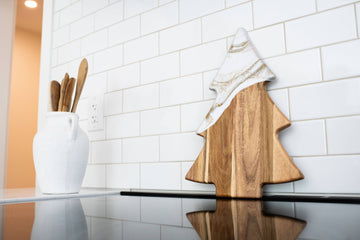 Christmas Tree Resin Charcuterie Board - Wooden charcuterie board shaped like a Christmas tree with natural wood grain and a hanging hole at the top.
