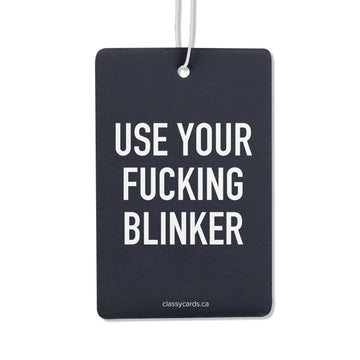 Use Your Fucking Blinker Air Freshener - Unique handmade Canadian air freshener with bold white "Use Your Fucking Blinker" text on black background, perfect gift.