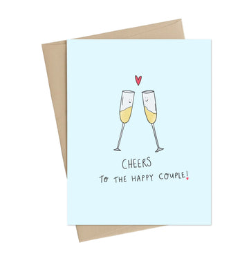 Cheers to the Happy Couple Greeting Card - Light blue greeting card with two clinking champagne glasses and red heart, handmade Canadian wedding gift design.