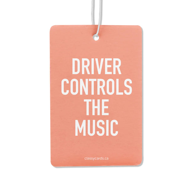 A pink air freshener with the words 