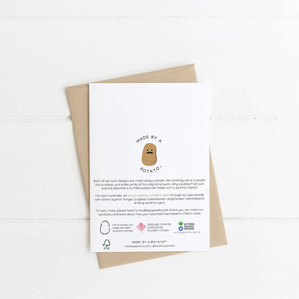 The back of the white card with a cartoon potato with a face and moustache in the middle