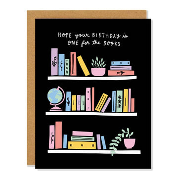 One for the Books Birthday Card - Black birthday card with colorful books, globe, and plants on shelves, unique handmade Canadian gift.