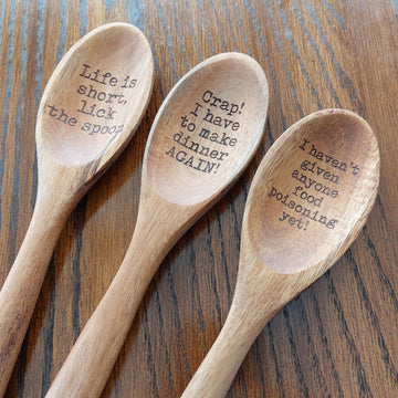 Funny Humor Laser Engraved Wooden Spoon - Set of three light wooden spoons with humorous engraved sayings in the scoops, featuring rustic finish and rounded handles.