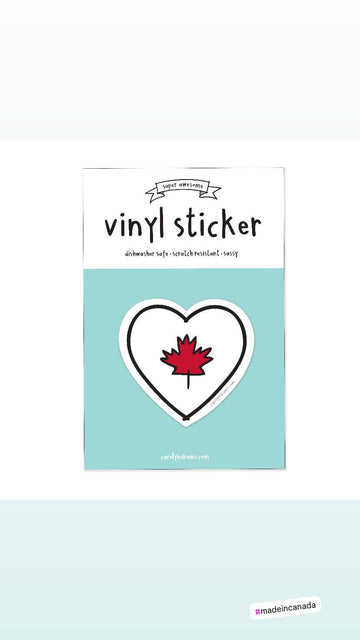 Canada Heart Flag Vinyl Sticker - Heart-shaped vinyl sticker with red Canadian maple leaf centered on white background.