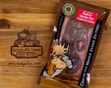 Fudge - Raspberry Chocolate Swirl - Handmade Canadian Raspberry Chocolate Swirl fudge in clear brown bag with cartoon moose, unique gift packaging.
