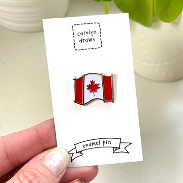 Canada Flag Enamel Pin - Handmade Canadian flag enamel pin with red maple leaf, unique gift accessory.